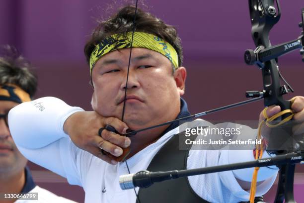 Woojin Kim of Team South Korea competes in the Men's Team quarterfinals on day three of the Tokyo 2020 Olympic Games at Yumenoshima Park Archery...