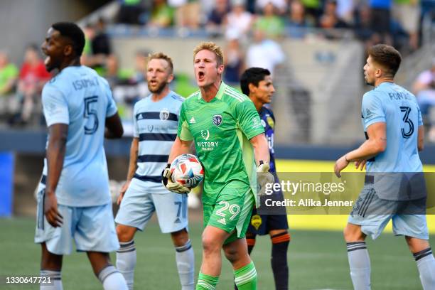 Tim Melia of Sporting Kansas City talks to his team after a Seattle Sounders shot on goal at Lumen Field on July 25, 2021 in Seattle, Washington. The...