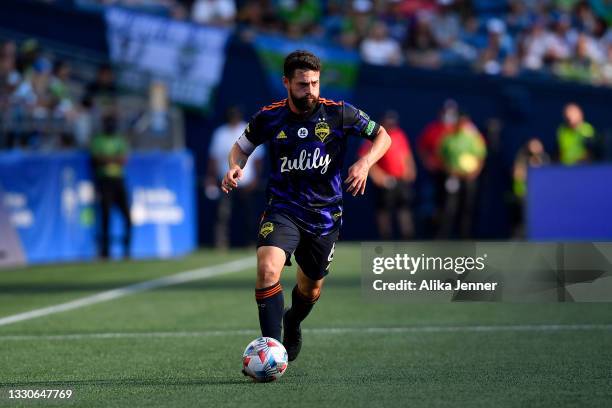 Joao Paulo of Seattle Sounders drives the ball during the game against the Sporting Kansas City at Lumen Field on July 25, 2021 in Seattle,...