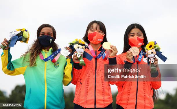 Rayssa Leal of Team Brazil and Momiji Nishiya and Funa Nakayama of Team Japan pose with their medals during the Women's Street Final medal ceremony...