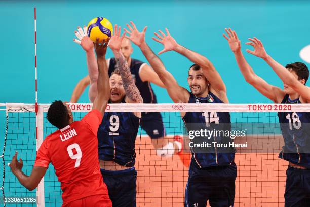 Wilfredo Leon Venero of Team Poland attacks against Team Italy during the Men's Preliminary Round - Pool A volleyball on day three of the Tokyo 2020...