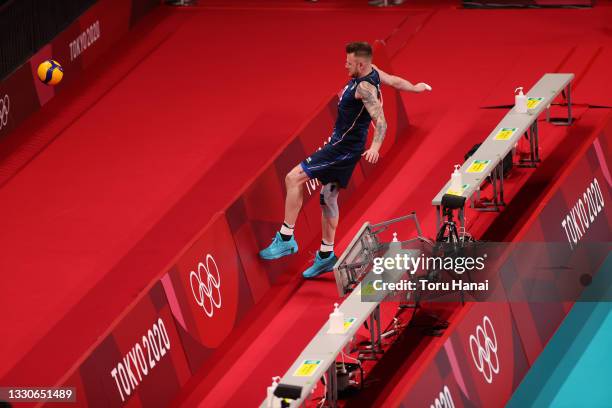 Ivan Zaytsev of Team Italy chases after a ball against Team Poland during the Men's Preliminary Round - Pool A volleyball on day three of the Tokyo...