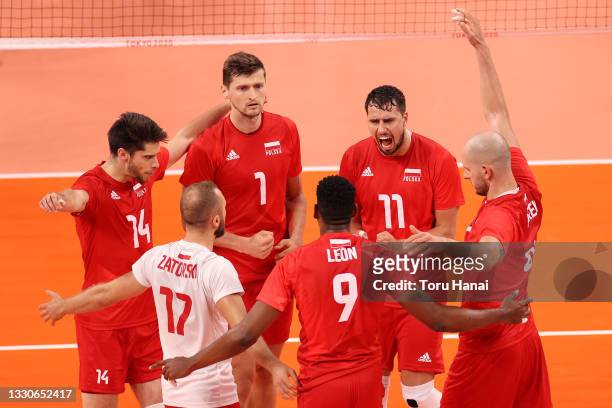 Team Poland celebrates against Team Italy during the Men's Preliminary Round - Pool A volleyball on day three of the Tokyo 2020 Olympic Games at...