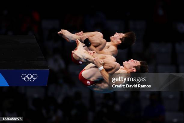 Vincent Riendeau and Nathan Zsombor-Murray of Team Canada compete during the Men's Synchronised 10m Platform Final on day three of the Tokyo 2020...