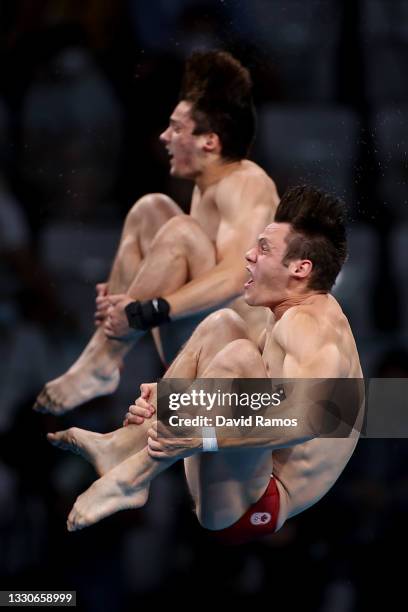 Vincent Riendeau and Nathan Zsombor-Murray of Team Canada compete during the Men's Synchronised 10m Platform Final on day three of the Tokyo 2020...