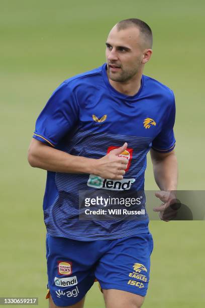 Dom Sheed runs laps around the perimeter of the ground during a West Coast Eagles training session at Mineral Resources Park on July 26, 2021 in...