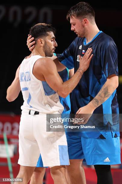 Luka Doncic of Team Slovenia embraces Facundo Campazzo of Team Argentina after the team's win against Argentina during the second half on day three...