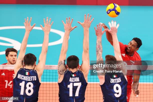 Wilfredo Leon Venero of Team Poland hits against Team Italy during the Men's Preliminary Round - Pool A volleyball on day three of the Tokyo 2020...