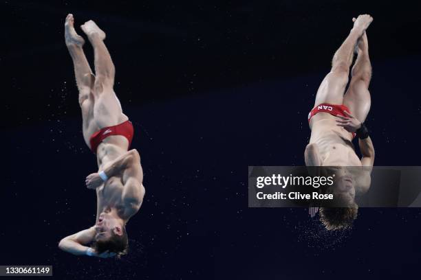 Vincent Riendeau and Nathan Zsombor-Murray of Team Canada compete during the Men's Synchronised 10m Platform Final on day three of the Tokyo 2020...