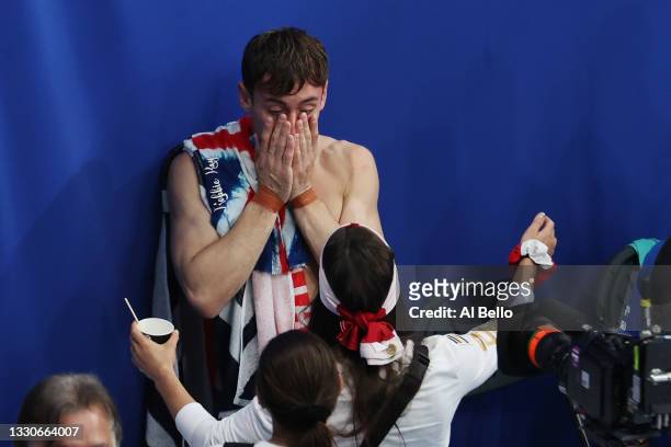 Tom Daley of Team Great Britain celebrates after winning gold in the Men's Synchronised 10m Platform Final on day three of the Tokyo 2020 Olympic...