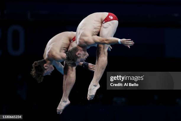 Nathan Zsombor-Murray and Vincent Riendeau of Team Canada compete during the Men's Synchronised 10m Platform Final on day three of the Tokyo 2020...