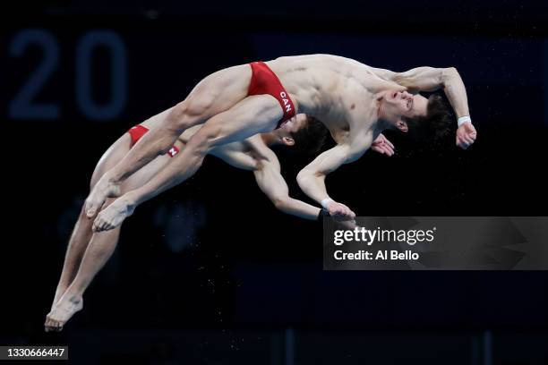 Nathan Zsombor-Murray and Vincent Riendeau of Team Canada compete during the Men's Synchronised 10m Platform Final on day three of the Tokyo 2020...