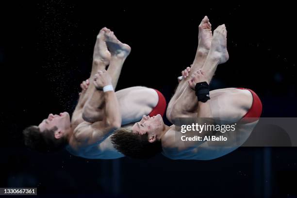 Vincent Riendeau and Nathan Zsombor-Murray of Team Canada compete during the Men's Synchronised 10m Platform Final on day three of the Tokyo 2020...