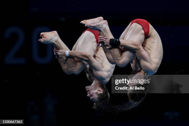 Vincent Riendeau and Nathan Zsombor-Murray of Team Canada compete during the Men's Synchronised 10m Platform Final on day three of the Tokyo 2020...