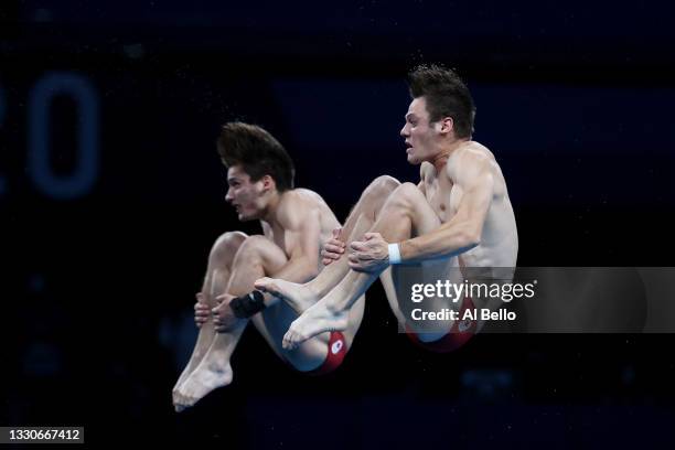 Vincent Riendeau and Nathan Zsombor-Murray of Team Canada compete during the Men's Synchronised 10m Platform Final on day three of the Tokyo 2020...