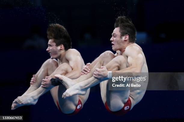 Vincent Riendeau and Nathan Zsombor-Murray of Team Canada compete during the Men's Synchronised 10m Platform Final on day three of the Tokyo 2020...
