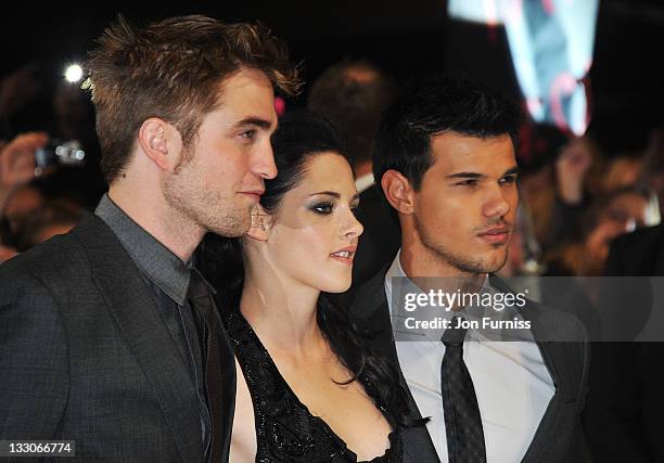 Actors Robert Pattinson, Kristen Stewart and Taylor Lautner attend 'The Twilight Saga: Breaking Dawn Part 1' UK Premiere, at Westfield Stratford City...