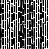 Abstract minimalistic seamless pattern with hand drawn black vertical short thick irregular dashed lines. Vector minimal monochrome black and white background design with styllized bamboo sticks