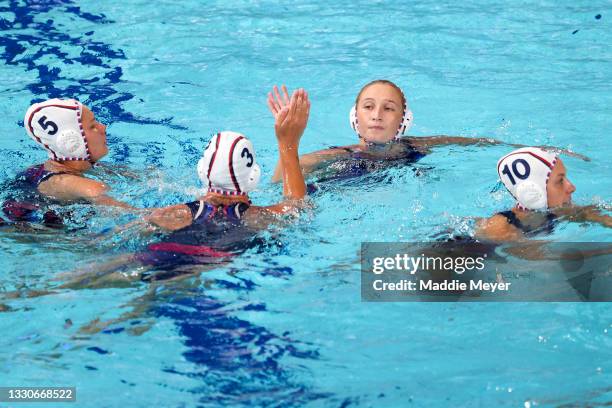 Ekaterina Prokofyeva and Elvina Karimova of Team ROC high five during the Women's Preliminary Round Group B match between Team ROC and Hungary on day...