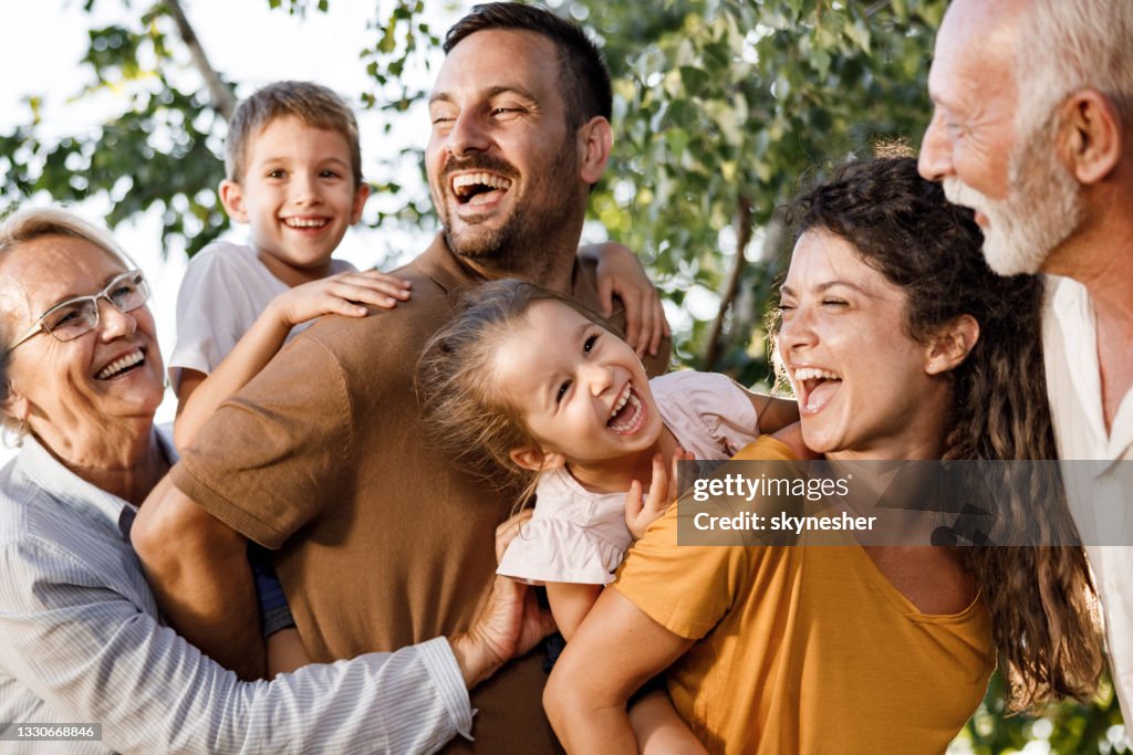 Cheerful extended family having fun in nature.