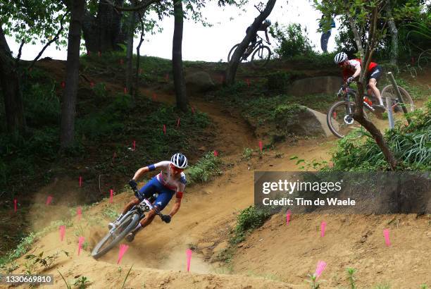 Thomas Pidcock of Team Great Britain ahead of Mathias Flueckiger of Team Switzerland during the Men's Cross-country race on day three of the Tokyo...