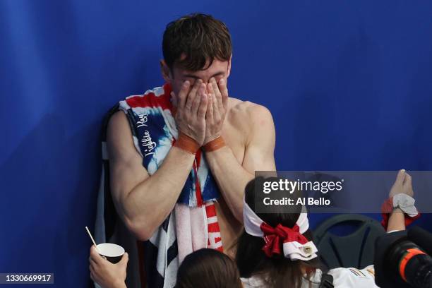 Tom Daley of Team Great Britain celebrates after winning gold in the Men's Synchronised 10m Platform Final on day three of the Tokyo 2020 Olympic...