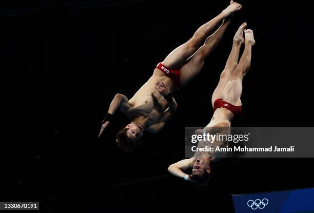 Vincent Riendeau and Nathan Zsombor-Murray of Team Canada compete during the Men's Synchronised 10m Platform Final on day three of the Tokyo 2020...