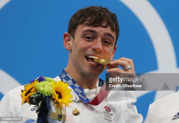 Tom Daley of Team Great Britain poses with the gold medal during the medal presentation for the Men's Synchronised 10m Platform Final on day three of...
