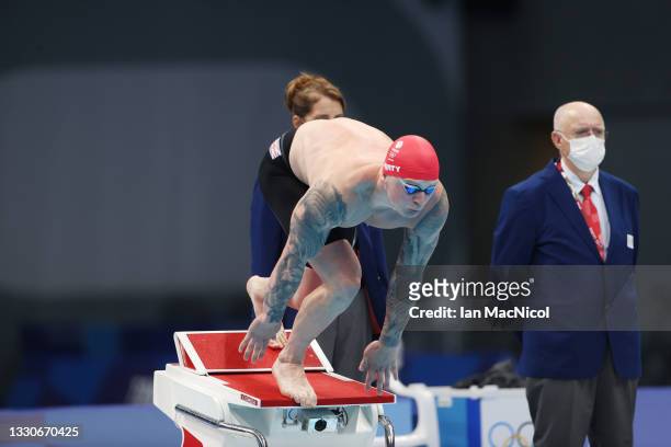 Adam Peaty of Great Britain competes in the final of the Men's 100m Breaststroke on day three of the Tokyo 2020 Olympic Games at Tokyo Aquatics...