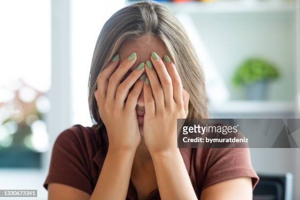 woman receiving bad news - guilt stock pictures, royalty-free photos & images