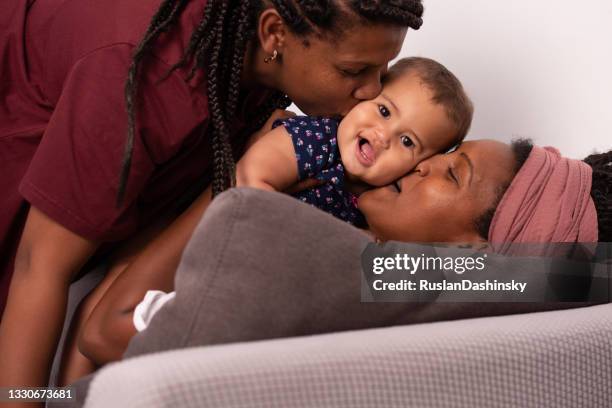 homosexual lesbian family with one child. - lesbian mom stock pictures, royalty-free photos & images