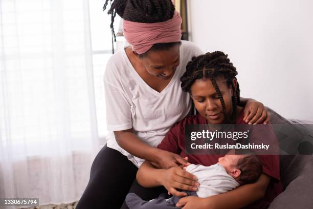 homosexual lesbian family with one child. - povo etíope imagens e fotografias de stock