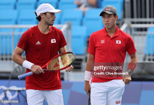 Kei Nishikori of Team Japan and Ben McLachlan of Team Japan play Jamie Murray of Team Great Britain and Neal Skupski of Team Great Britain in their...