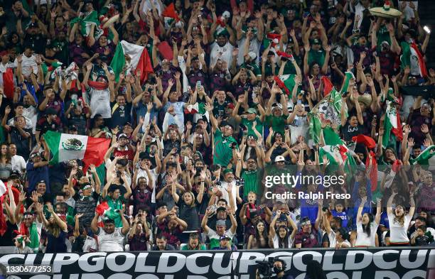 Fans of the Mexico national soccer team cheer during the first half of the Concacaf Gold Cup quarterfinal match between Mexico and the Honduras at...