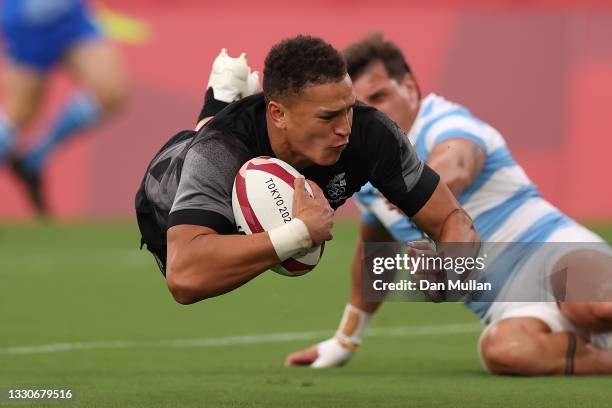 William Warbrick of Team New Zealand dives in to score a try during the Men's Pool A Rugby Sevens match between New Zealand and Argentina on day...