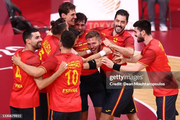 Aleix Gomez Abello of Team Spain celebrates with teammates after scoring the game winning goal from a penalty after winning the Men's Preliminary...