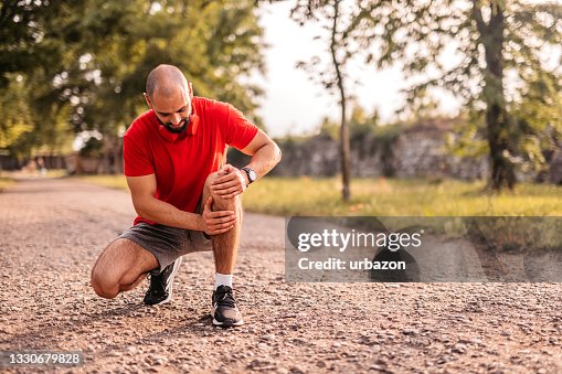 Sportsman hurting his knee during running Sportsman hurting his knee during running