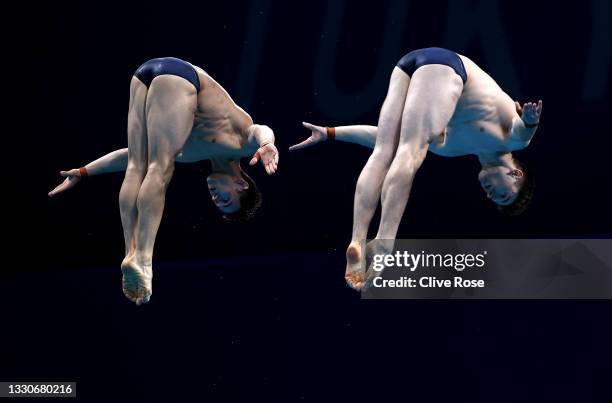 Tom Daley and Matthew Lee of Team Great Britain compete during the Men's Synchronised 10m Platform Final on day three of the Tokyo 2020 Olympic Games...