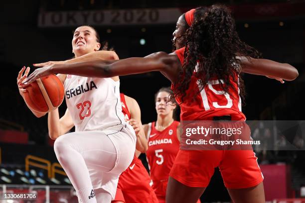 Ana Dabovic of Team Serbia is stripped of the ball by Laeticia Amihere of Team Canada during the first half of the Women's Preliminary Round Group A...