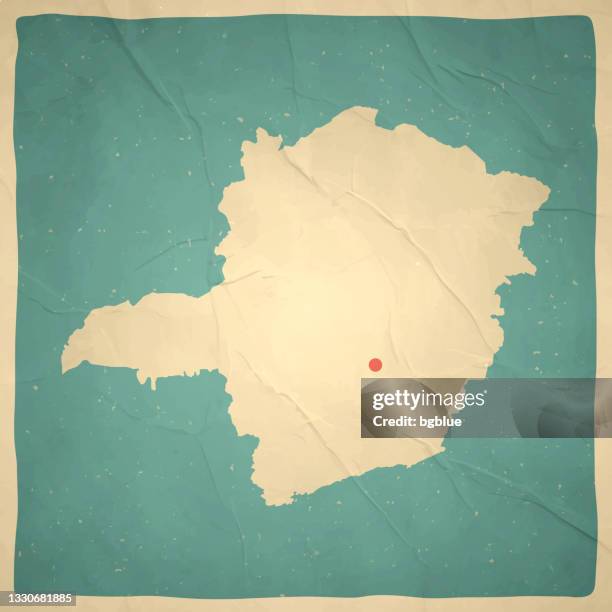 minas gerais map in retro vintage style - old textured paper - sepia toned background stock illustrations