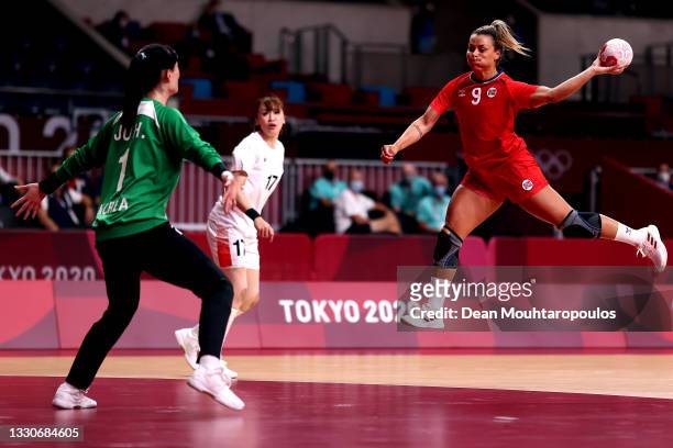 Nora Moerk of Team Norway shoots on goal at Goalkeeper, Hui Ju of Team South Korea during the Women's Preliminary Round Group A match between Norway...