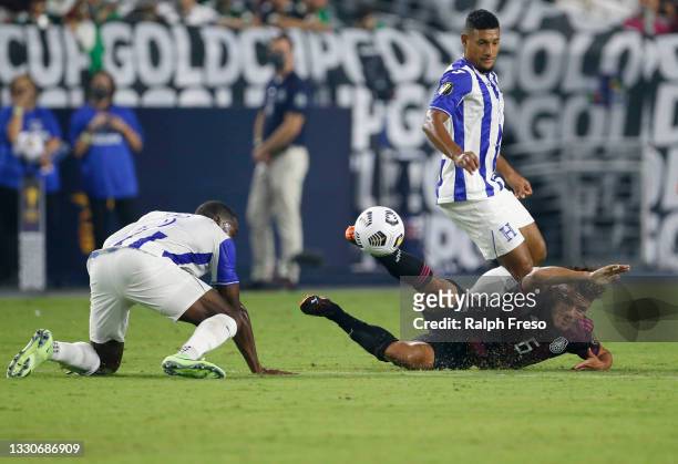 Jonathan Dos Santos of Mexico is knocked down by Maynor Figueroa of Honduras during the first half of the Concacaf Gold Cup quarterfinal match at...