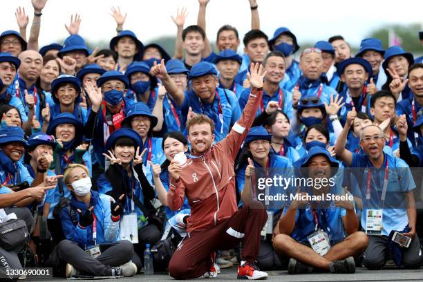 Mathias Flueckiger of Team Switzerland celebrates winning the silver medal and pose with Japanese fans after the Men's Cross-country race on day...