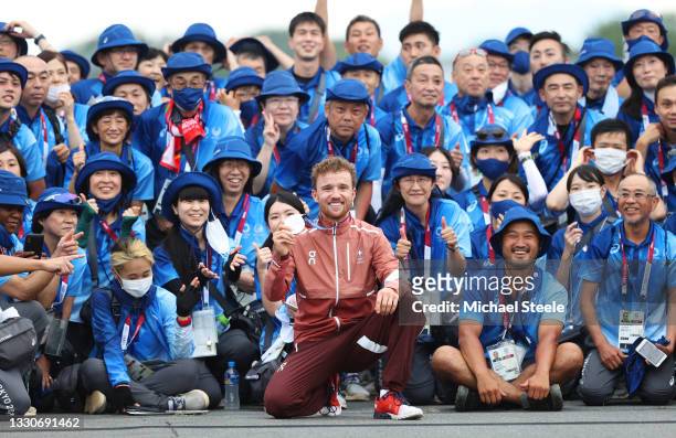 Mathias Flueckiger of Team Switzerland celebrates winning the silver medal and pose with Japanese fans after the Men's Cross-country race on day...