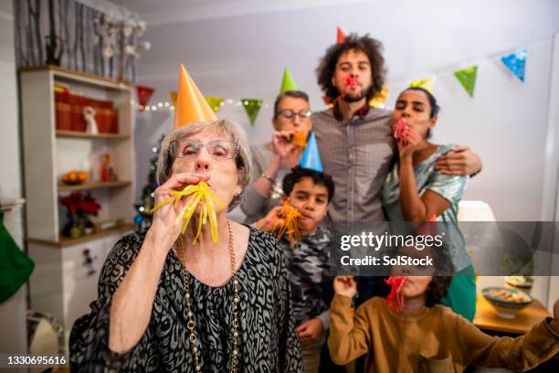 loving family celebrating new year - 30 year old portrait in house stockfoto's en -beelden