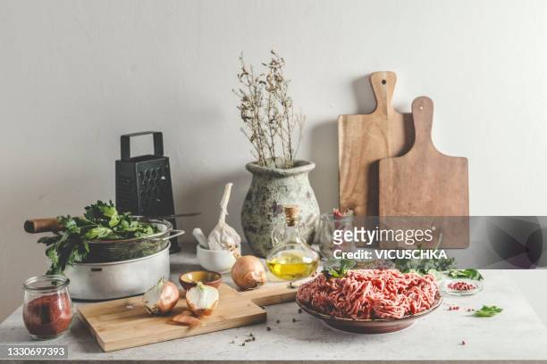 preparing meatballs at home . food still life with ingredients and kitchen utensils - ingredients kitchen stock pictures, royalty-free photos & images