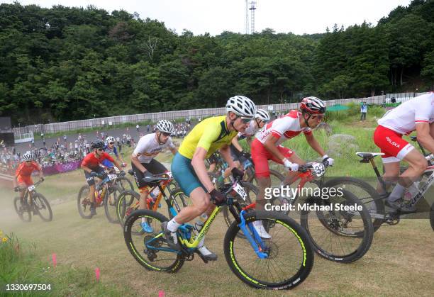Jofre Cullell Estape of Team Spain, Daniel Mcconnell of Team Australia and Kohei Yamamoto of Team Japan ride during the Men's Cross-country race on...