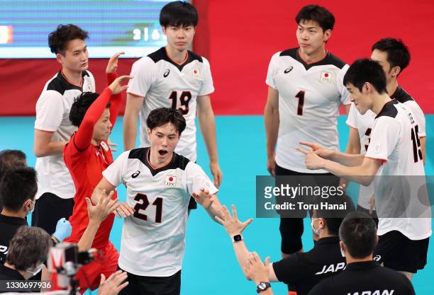 Ran Takahashi of Team Japan reacts with team mates before match against Team Canada during the Men's Preliminary Round - Pool A volleyball on day...