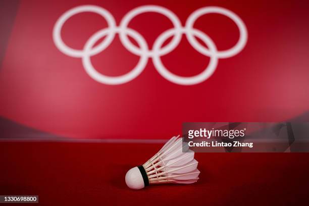 Shuttlecock is placed with Olympic rings on the badminton court on day three of the Tokyo 2020 Olympic Games at Musashino Forest Sport Plaza on July...
