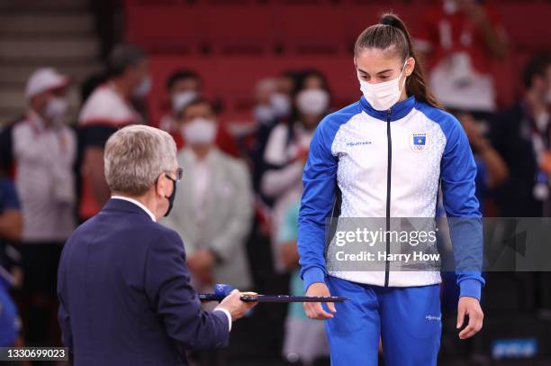 Nora Gjakova of Team Kosovo receives the gold medal for the Women’s Judo 57kg event on day three of the Tokyo 2020 Olympic Games at Nippon Budokan on...